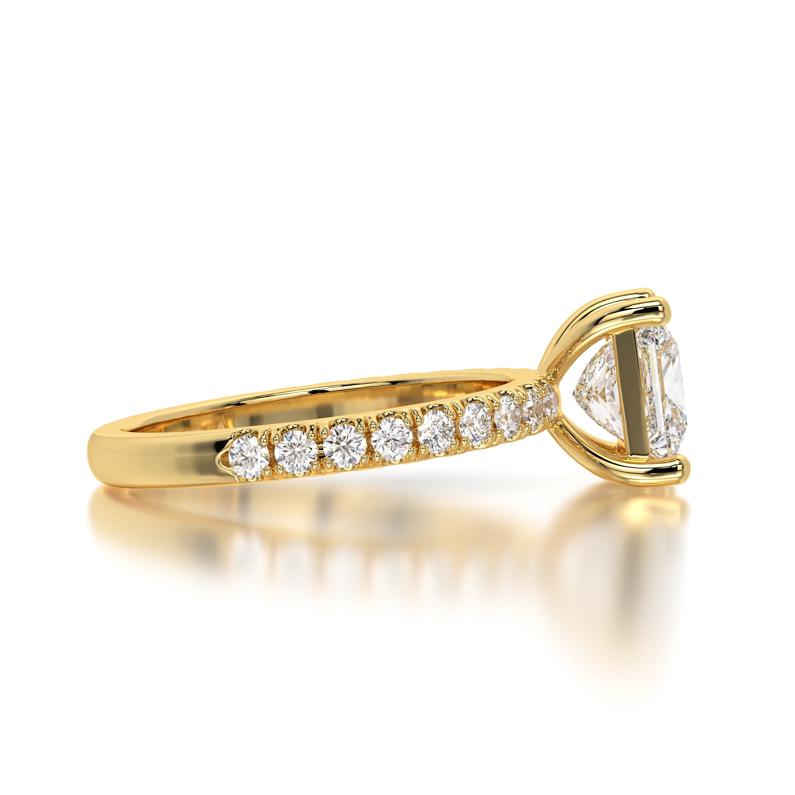Close-up of the ring's bold four-prong setting and brilliant faceting that enhances its geometric shape. Angled shot highlighting 0.65 carats of pavé-set side diamonds along the gold band with VVS–VS clarity and F–G color.