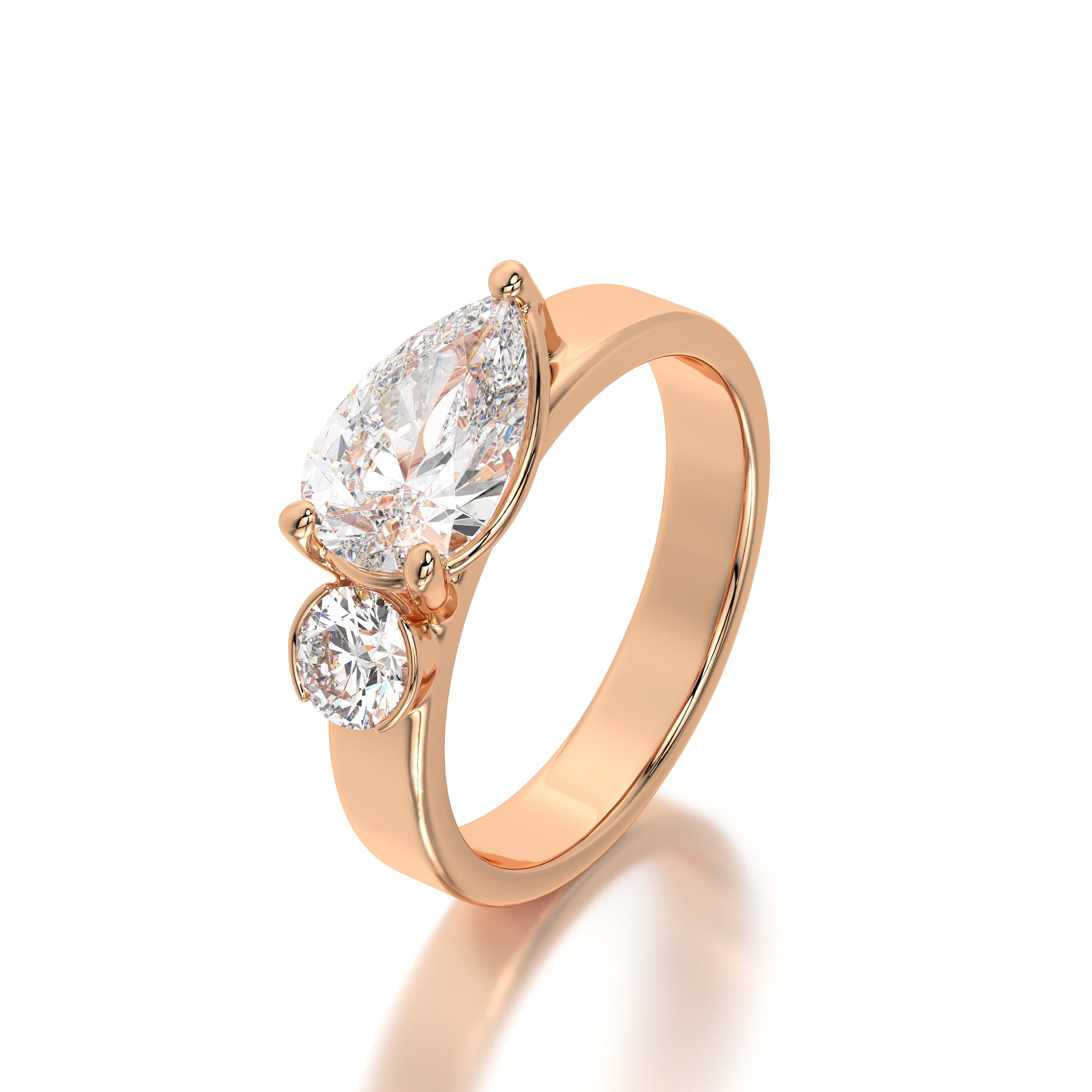 Lifestyle image of the pear and round diamond ring worn on the hand, showcasing its elegance as an engagement or anniversary piece.