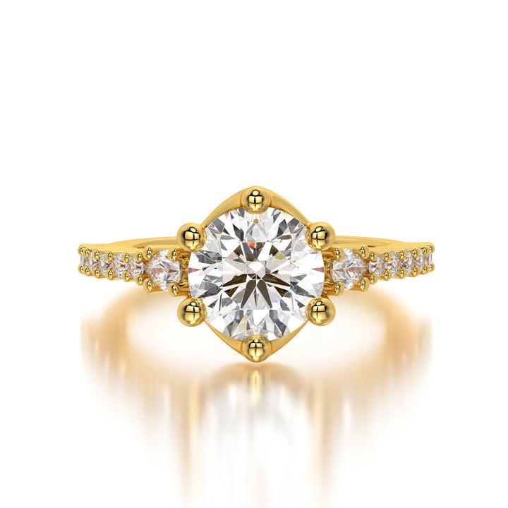 Close-up image of a 1.75 carat round lab-grown diamond engagement ring in 18K yellow gold, featuring a six-prong setting and brilliant-cut solitaire. Front view of the ring showcasing its sparkling 0.58 carats of side diamonds with VVS-VS clarity and F-G color.
