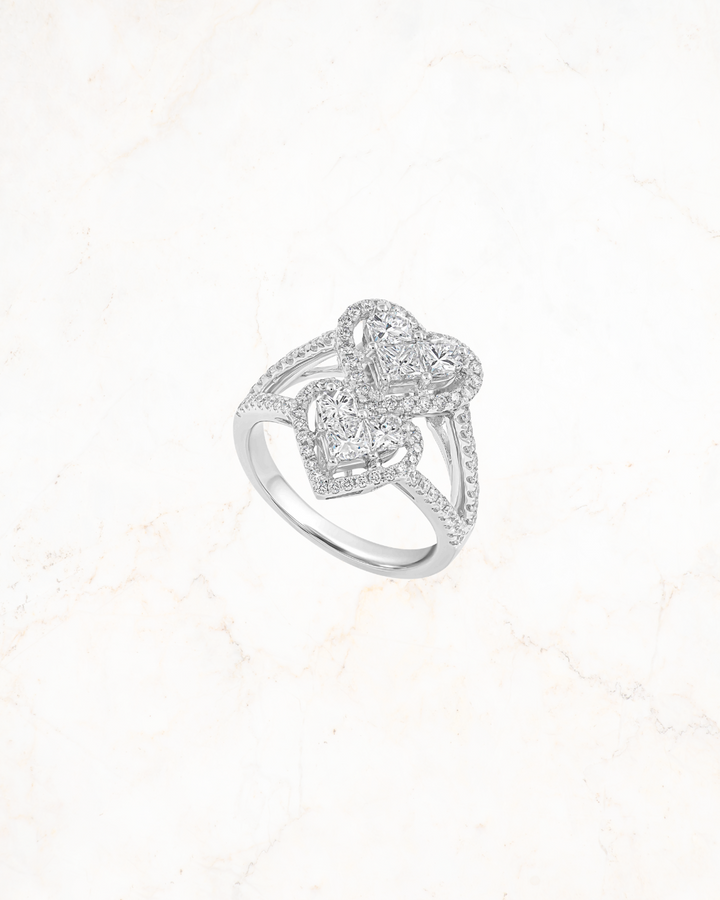 custom jewelry store Dubai, white gold heart motif ring, EVA GEMS luxury diamond collection, handcrafted heart diamond ring, love-inspired ring Dubai, best diamond ring shop UAE, elegant bridal ring EVA GEMS