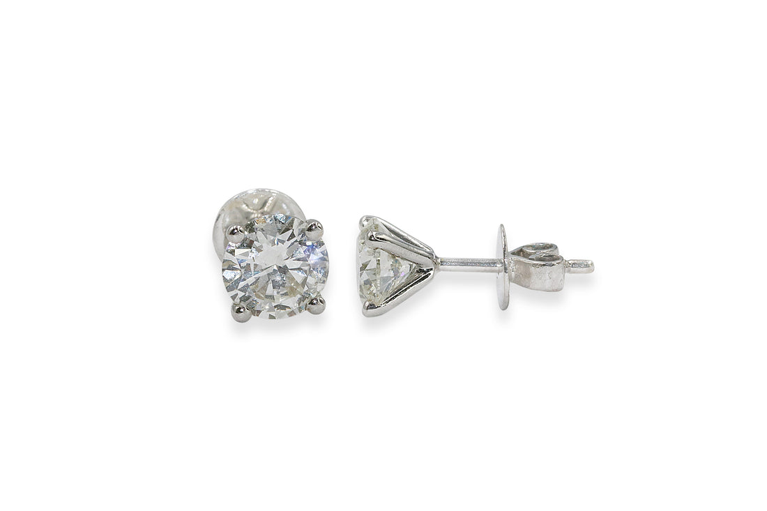 Exquisite solitaire diamond earrings with a 4-prong setting, available at EVA GEMS Dubai.